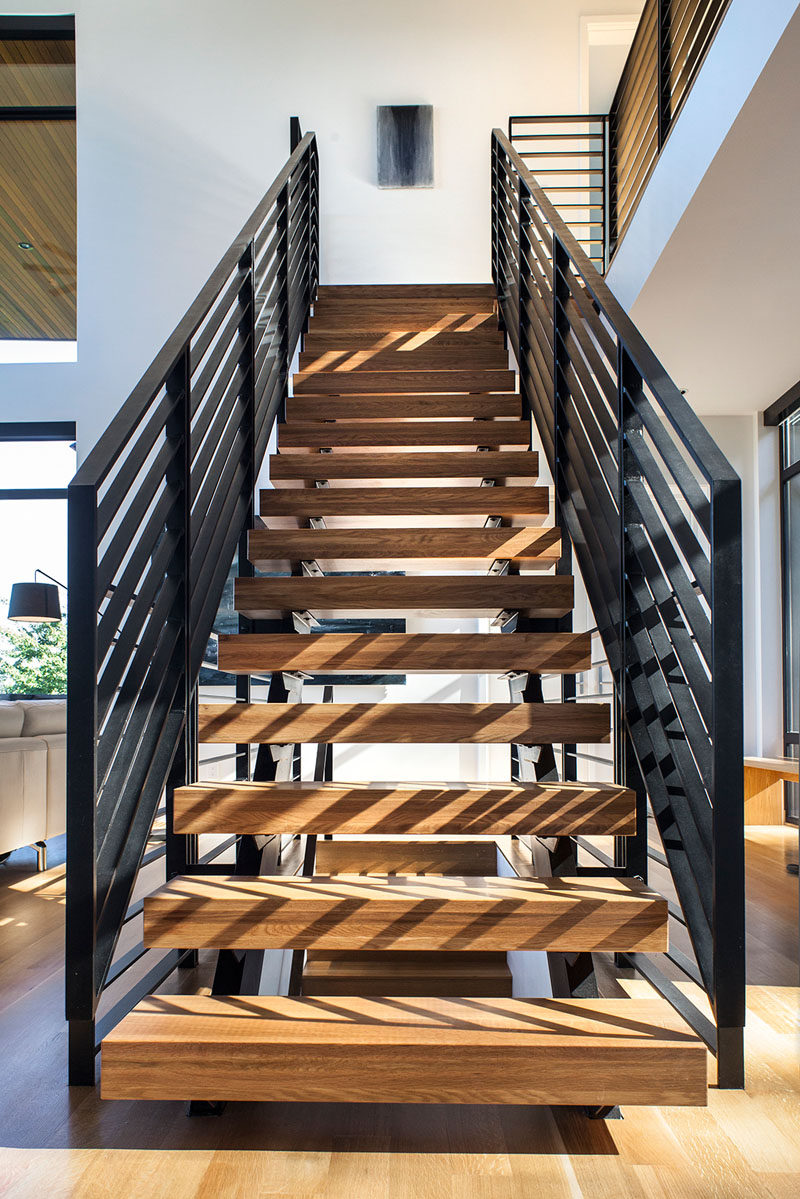 Wood and steel stairs guide you through various levels of this home.