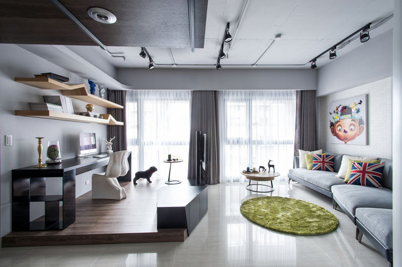 Apartment Design Idea - Divide Space By Slightly Elevating An Area. When interior design firm CHI-TORCH were designing this apartment in Taiwan, they decided to split the main living area into two distinct zones, a living room and an office.