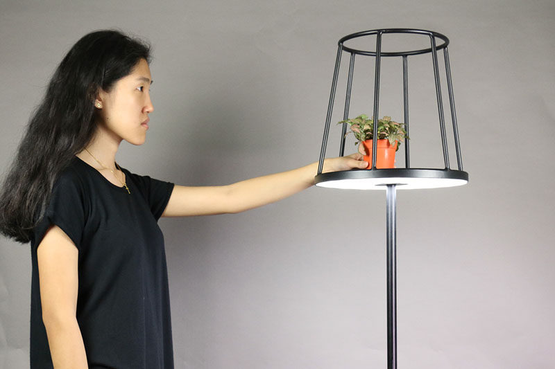 Designer Kevin Chiam has recreated the classic floor lamp, but with a modern twist. Instead of the light hidden by a lampshade, the shade is just a silhouette, with the light shining out from the base of the shade, making way to display your favorite item.