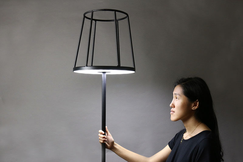 Designer Kevin Chiam has recreated the classic floor lamp, but with a modern twist. Instead of the light hidden by a lampshade, the shade is just a silhouette, with the light shining out from the base of the shade, making way to display your favorite item.