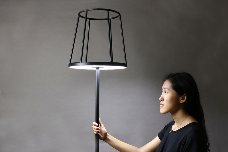 Designer Kevin Chiam has recreated the classic floor lamp, but with a modern twist. Instead of the light hidden by a lampshade, the shade is just a silhouette, with the light shining out from the base of the shade, making way to display your favorite item.