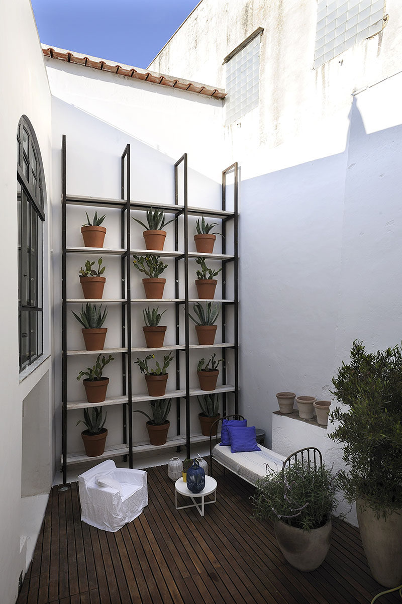 WALL DECOR IDEA - Create A Grid Of Planters On A Shelving Unit For A Contemporary Plant Wall