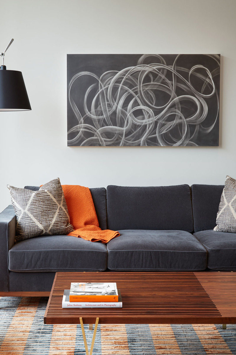 LIVING ROOM COLOR PALETTE --- Grey tones, wood and orange