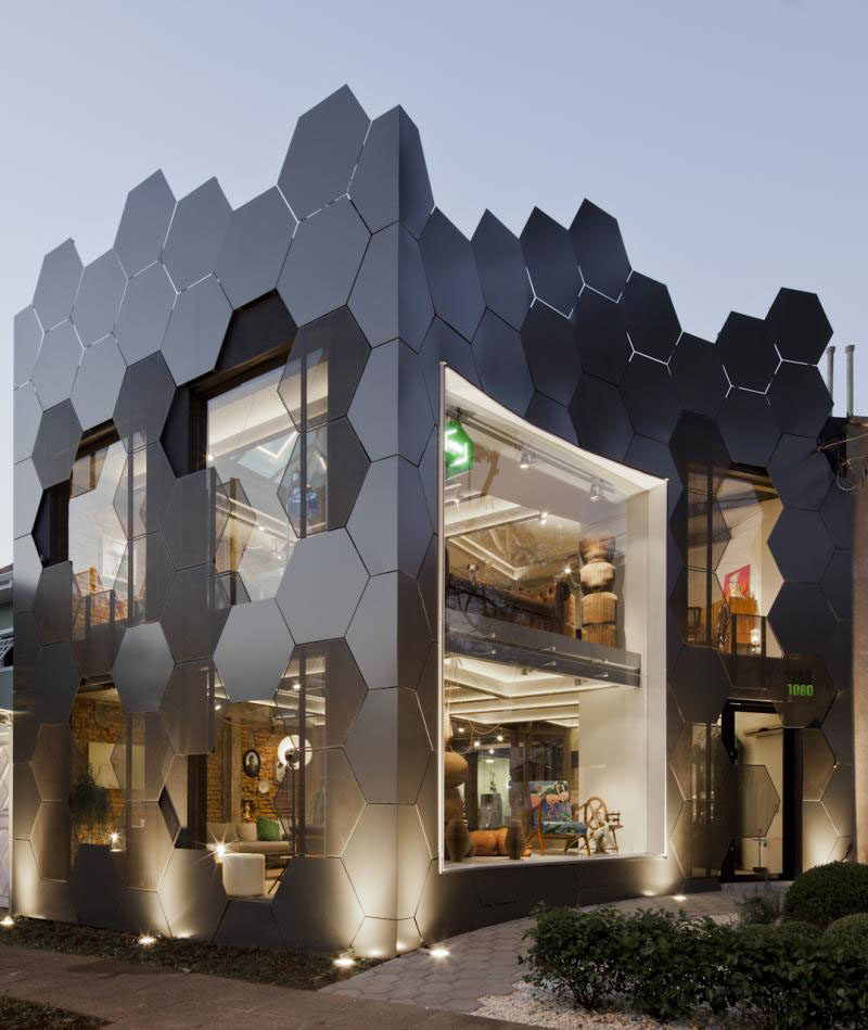 This honeycomb inspired facade, full of hexagonal shapes, was created for the Estar Móveis shop in São Paulo, Brazil.