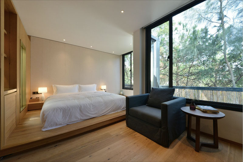 In this hotel room, a raised floor separates the bed from the rest of the room.