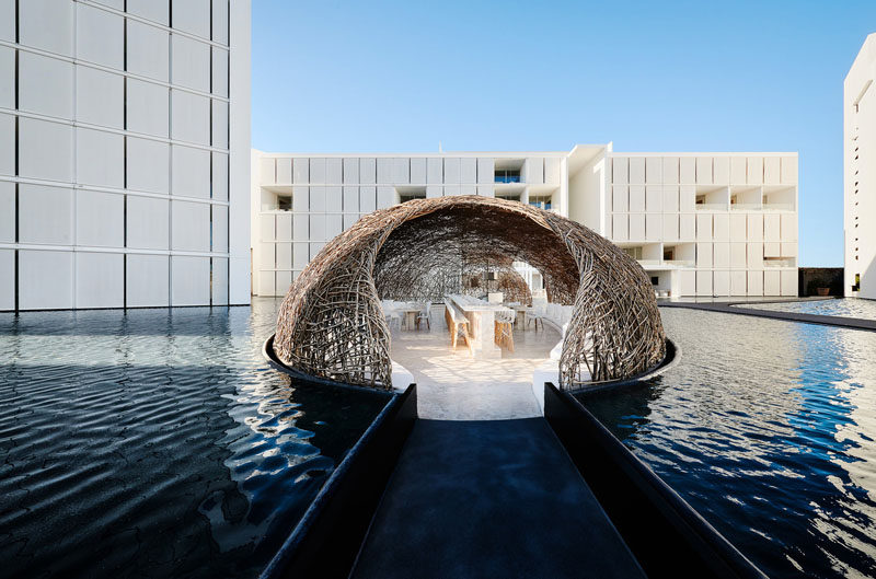 Surrounded entirely by water, made from thin strips of wood and seeming to float right on its surface is Restaurant Nido; one of the three world class restaurants at Mar Adentro Hotel, a five-star hotel designed by Miguel Ángel Aragonés in San José del Cabo, Mexico.