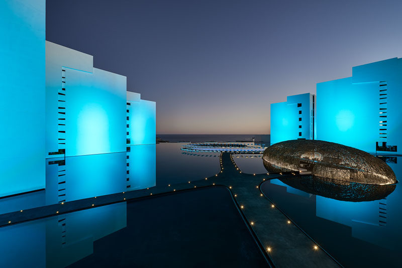 Surrounded entirely by water, made from thin strips of wood and seeming to float right on its surface is Restaurant Nido; one of the three world class restaurants at Mar Adentro Hotel, a five-star hotel designed by Miguel Ángel Aragonés in San José del Cabo, Mexico.