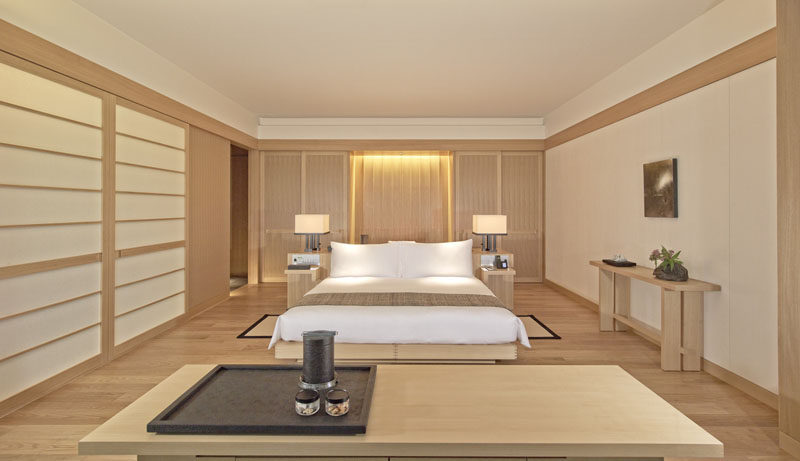 Often Japanese design can be seen as very minimalist in its design, with bare rooms, white or concrete walls and minimal furniture, but these hotel suites at the new Aman Tokyo, show that Japanese design can also be warm and welcoming.