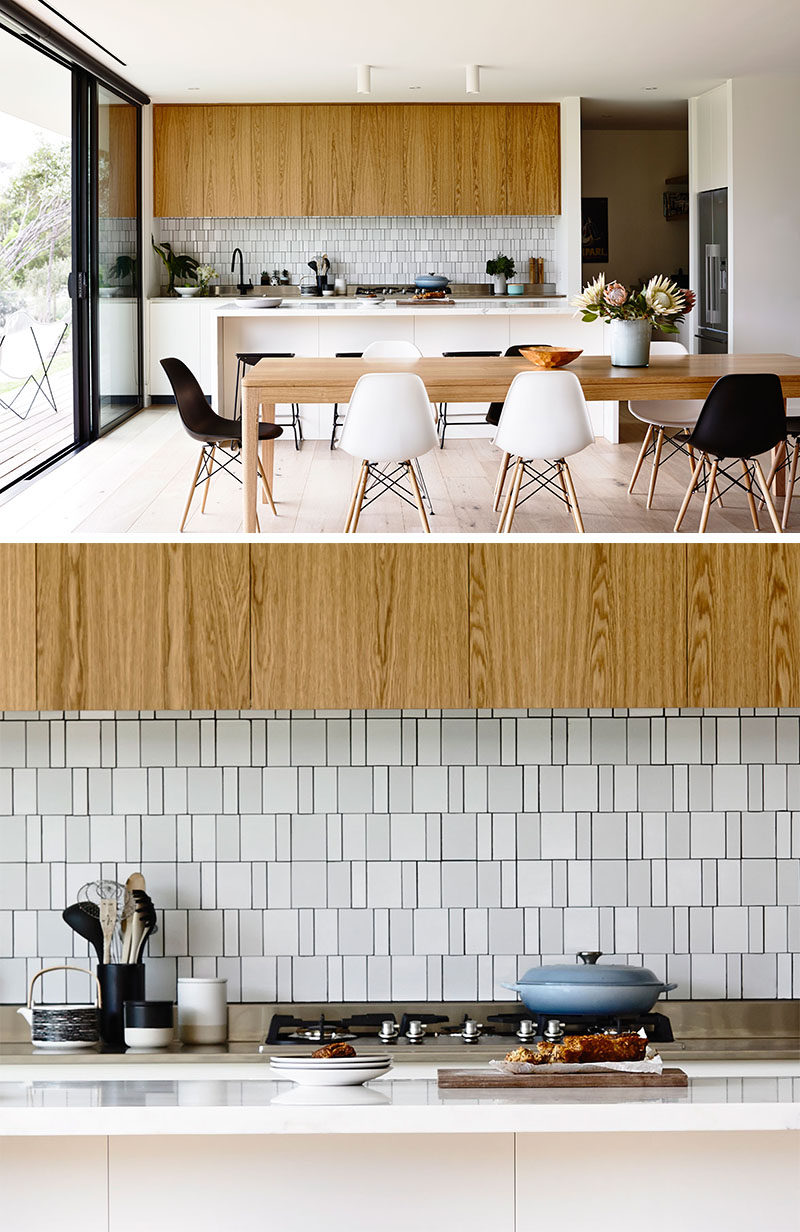 9 Inspirational Pictures Of Kitchens With Geometric Tiles // The backsplash of this kitchen uses white rectangular tiles in various sizes to create a textured appearance.