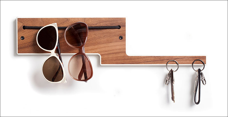 16 Key Holders To Keep You Organized // This entry way organizer uses embedded magnets to hold your keys while an elastic band keeps sunglasses at the ready.