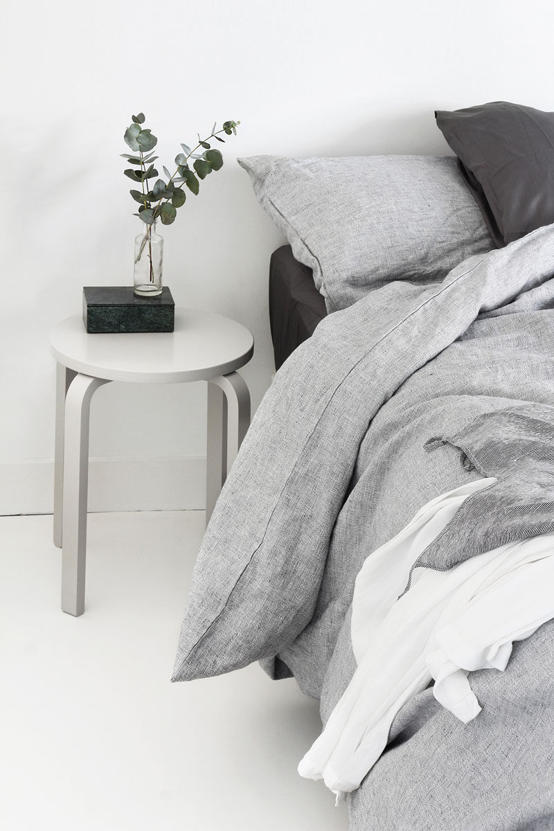 9 Different Ideas For Adding A Nightstand To Your Bedroom // 9 Different Ideas For Adding A Nightstand To Your Bedroom // A Simple Stool --- Keep bedside clutter to a minimum by using a small table that's just large enough for a book, a light, and some greenery.