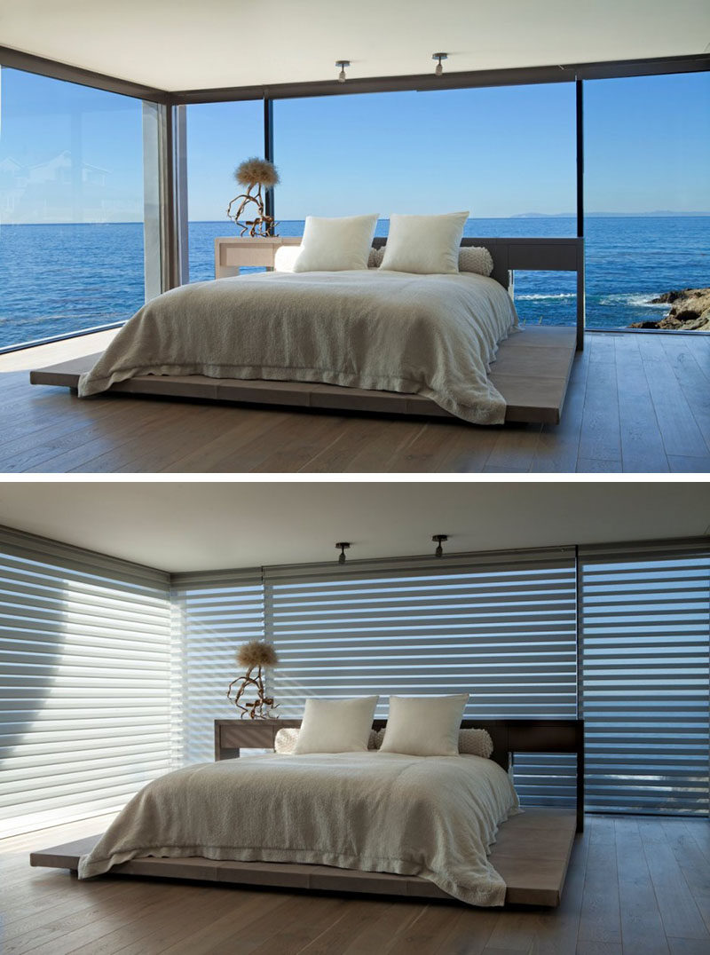 BEDROOM DESIGN IDEA - Place Your Bed On A Raised Platform // This platform bed is surrounded by incredible ocean views, making the bedroom experience that much more unique.