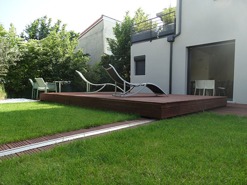 This raised wooden deck in the backyard is actually a pool cover.