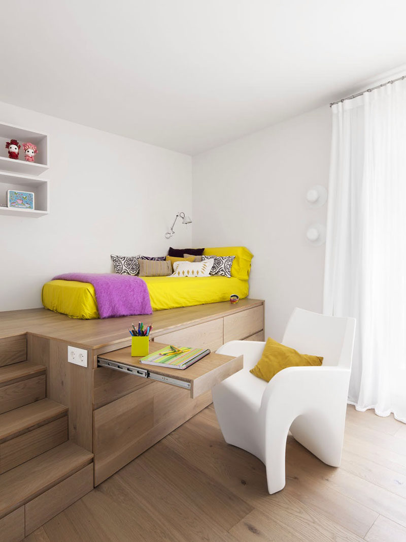 14 Inspirational Bedroom Ideas For Teenagers // Multiple levels with built-in storage and pops of yellow breaking up the otherwise neutral pallet, keep this teen space functional and easily changeable as the years go by.