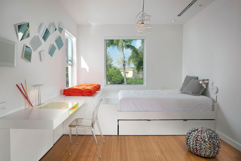 14 Inspirational Bedroom Ideas For Teenagers // An extra pull out bed a window seat, and a desk make this an ideal space for a teen who likes having sleepovers with friends, but also needs a place all their own to relax and recharge in.