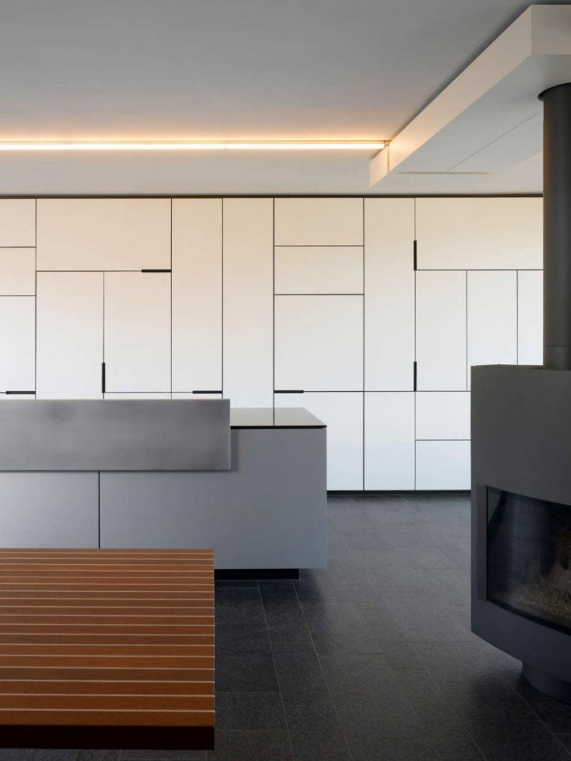 5 Ideas For Unconventional Cabinet Door Designs // These kitchen cabinets play with the sizes of the cabinet doors to create an artistic detail far more interesting than an all white wall of vertical lines.