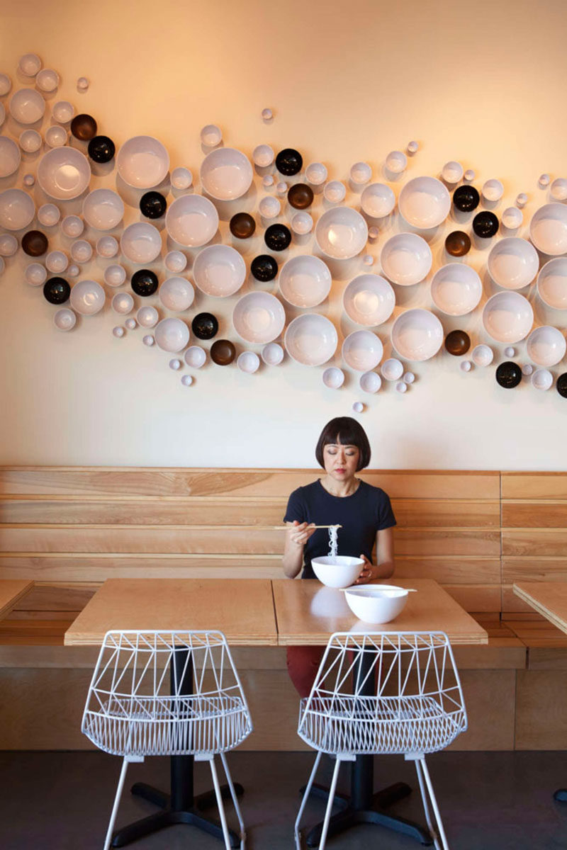 This Asian-American fusion restaurant has bowls installed on the wall to create a unique accent.