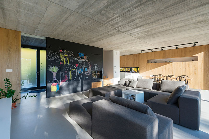 The chalkboard wall in this family living room provides the kids with a spot to get creative.