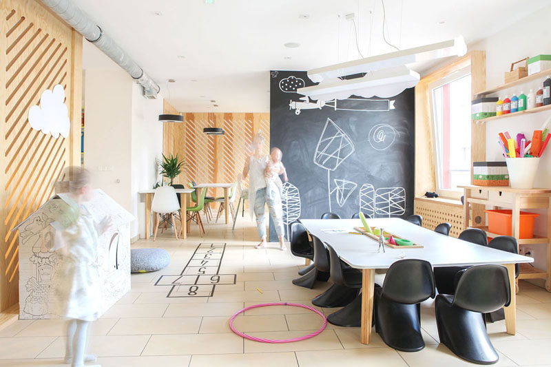 A chalkboard accent wall designed for kids to draw on.