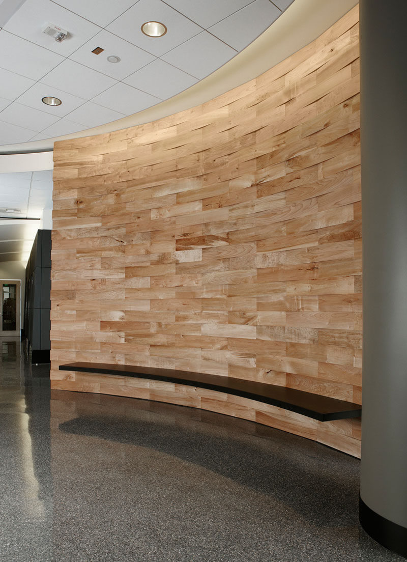 Accent Wall Ideas - 12 Different Ways To Cover Your Walls In Wood // Salvaged and cleaned wood makes up the body of this curved accent wall in a commercial space.  #AccentWall #FeatureWall #WoodAccentWall #WoodFeatureWall #InteriorDesign