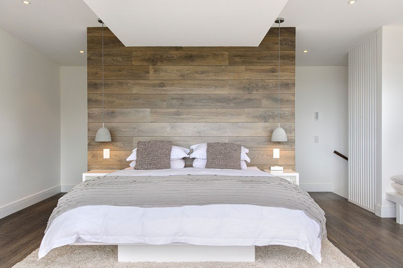 Accent Wall Ideas - 12 Different Ways To Cover Your Walls In Wood // Reclaimed wood panels line this headboard that doubles as a rustic contemporary feature wall.  #AccentWall #FeatureWall #WoodAccentWall #WoodFeatureWall #InteriorDesign