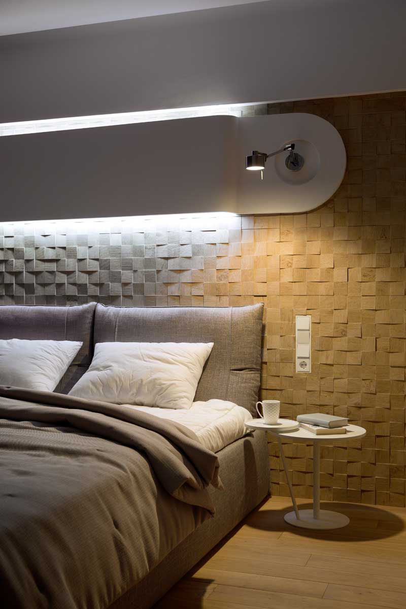 Accent Wall Ideas - 12 Different Ways To Cover Your Walls In Wood // Slightly uneven wood blocks with their grains arranged in random order, add texture and coziness to this bedroom.  #AccentWall #FeatureWall #WoodAccentWall #WoodFeatureWall #InteriorDesign