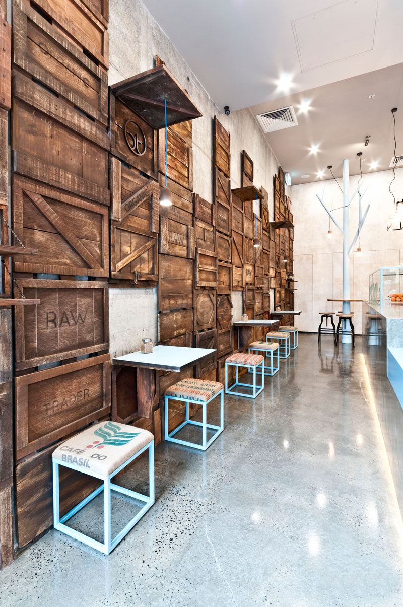 Accent Wall Ideas - 12 Different Ways To Cover Your Walls In Wood // Stained wood crates have been dismantled and reassembled on this wall, creating a rustic yet contemporary feel in the space.  #AccentWall #FeatureWall #WoodAccentWall #WoodFeatureWall #InteriorDesign