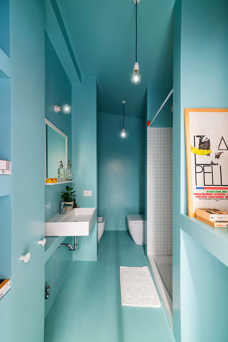 13 Inspirational Examples Of Blue And White Bathrooms // The commitment to the blue and white theme is evident in this bathroom that used blue grout between the white tiles in the shower.