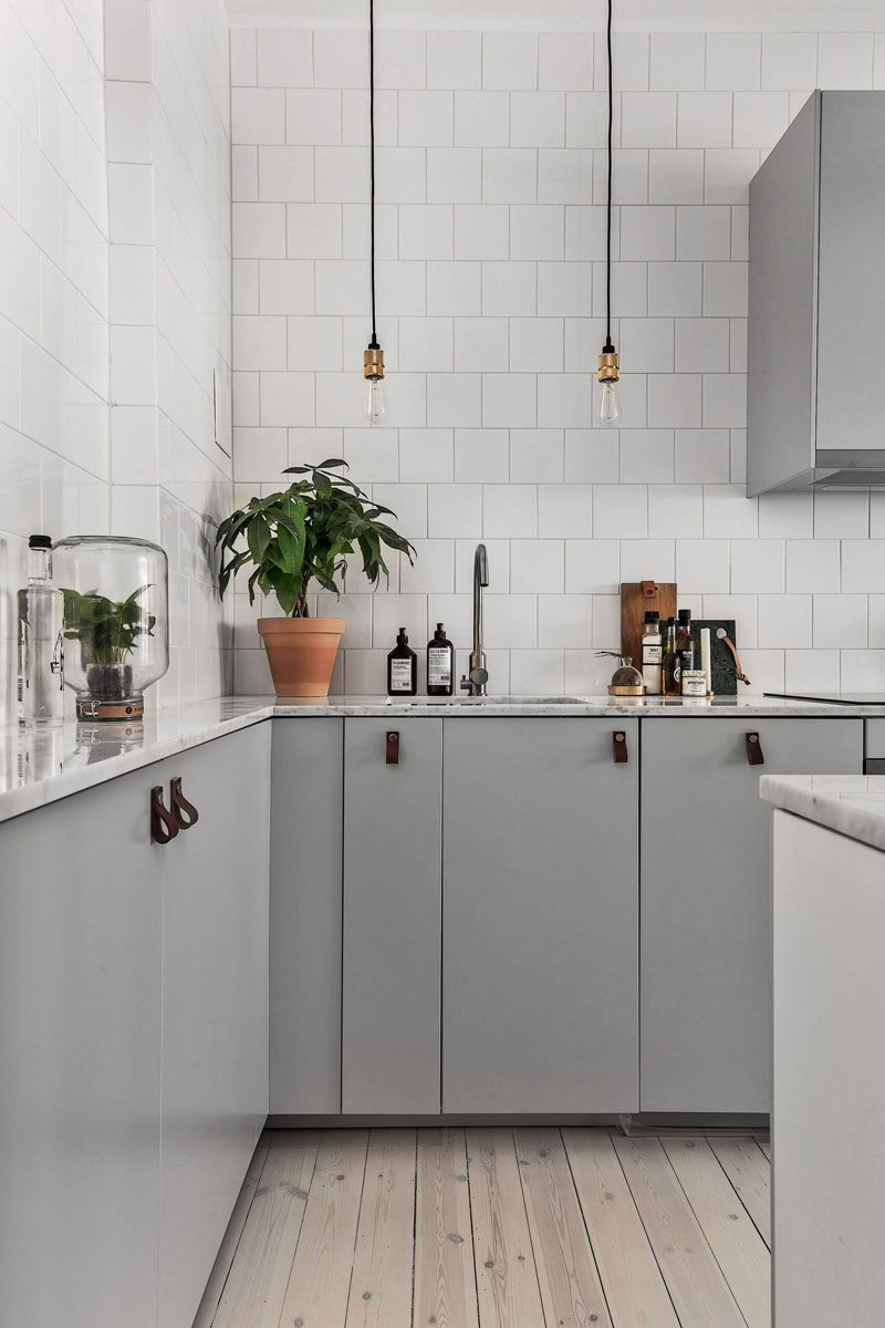 Kitchen Design Idea - Cabinet Hardware Alternatives // Create a Scandinavian look into your kitchen with leather cabinet pulls.