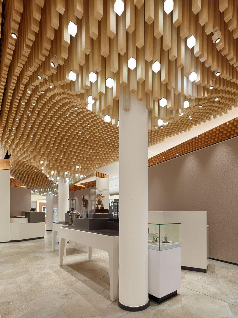 Modern Ceiling Design Idea - 4362 Square Wooden Dowels Cover The Ceiling Of This Watch Showroom
