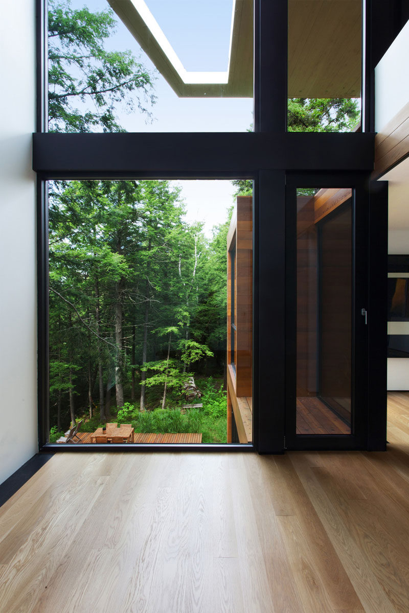 This home features large windows throughout, which allows the natural light to fill the home and bounce off the expansive, white walls.