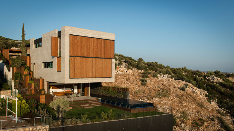 Located on a steep slope in Çesme, Turkey, is this home that has a huge section that cantilevers out 26 feet (8 meters), providing a dramatic look for the design.