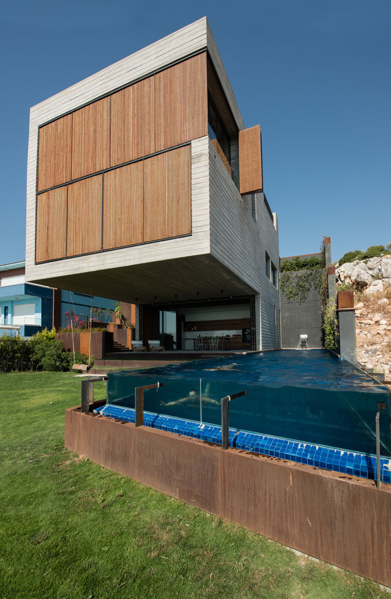 Located on a steep slope in Çesme, Turkey, is this home that has a huge section that cantilevers out 26 feet (8 meters), providing shade for the backyard and swimming pool.