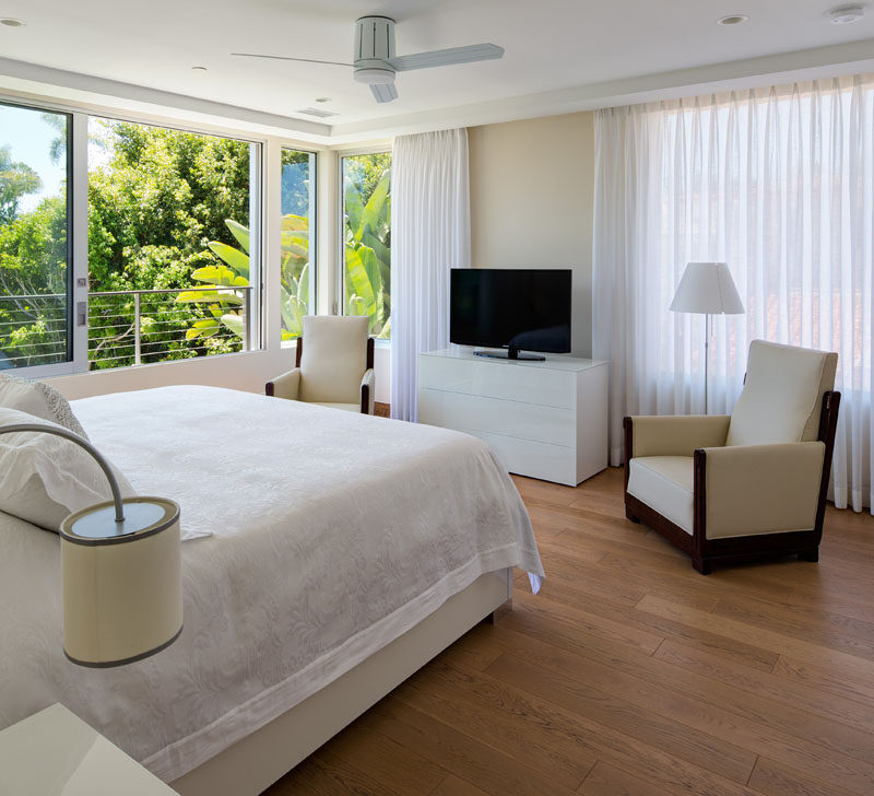 Lots of light enters this bedroom from the large floor-to-ceiling windows and private balcony.