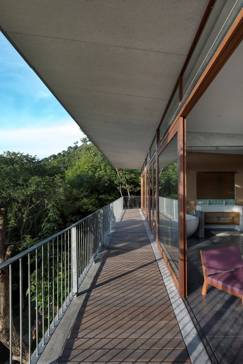 A long balcony provides access to the bedrooms of this home.