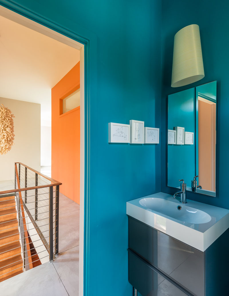 This bathroom is full of energy with its bright blue walls.