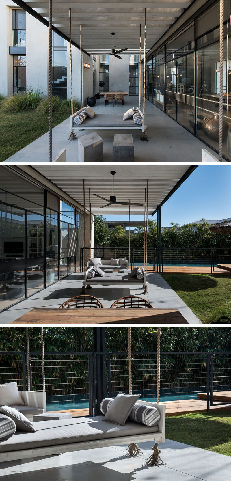 This covered patio is home to a couple of swing benches and an outdoor dining table.