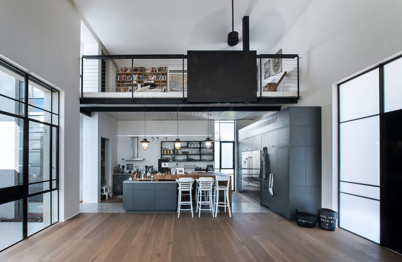 This home has a lofted reading space located directly above the kitchen.