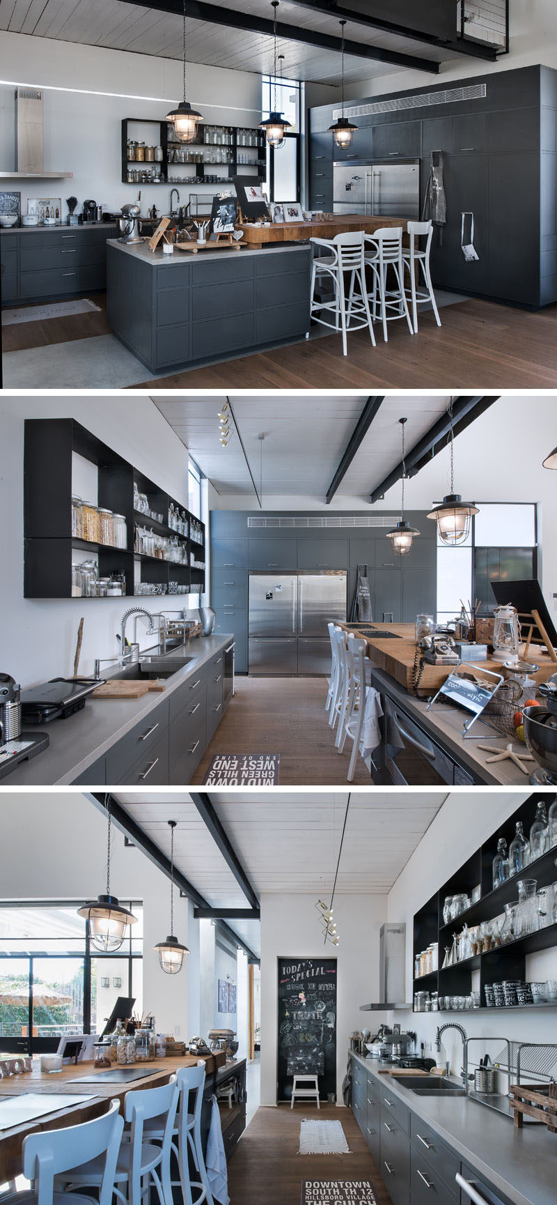 In this kitchen, the central island has a large wooden butcher block top, and white accents, like the chairs, pop against the dark gray cabinets.