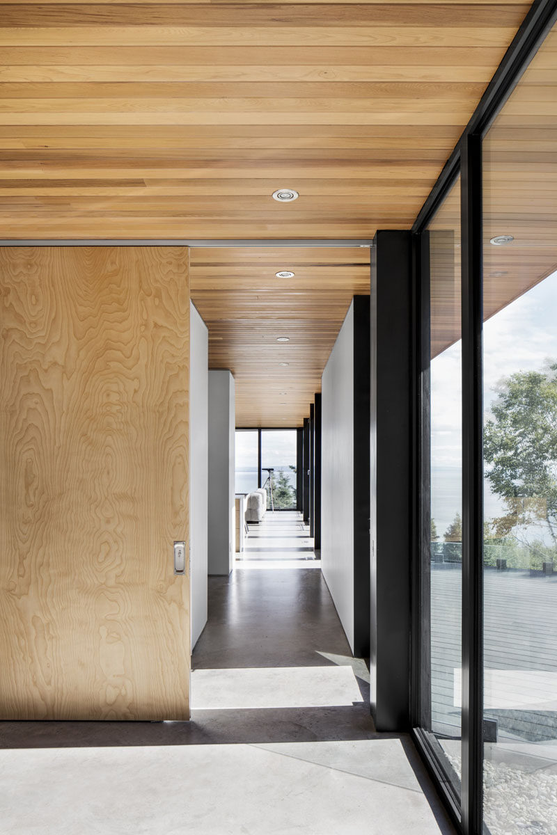 Western Cedar on the overhangs extend from the outside of this home through to the ceiling inside.