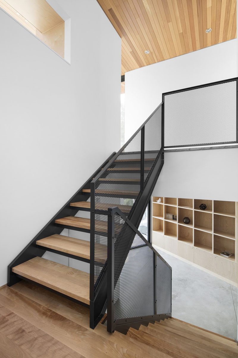 These stairs combine wood, black metal and mesh to create a contemporary look.