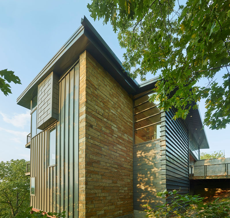 The multi-level home has used materials such as stone, steel and glass, with deliberate emphasis given to exterior views for color, and landscape for an accent. 