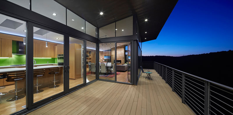 This balcony extends the living space of this home and during the day provides views of the ever changing trees depending on the season.