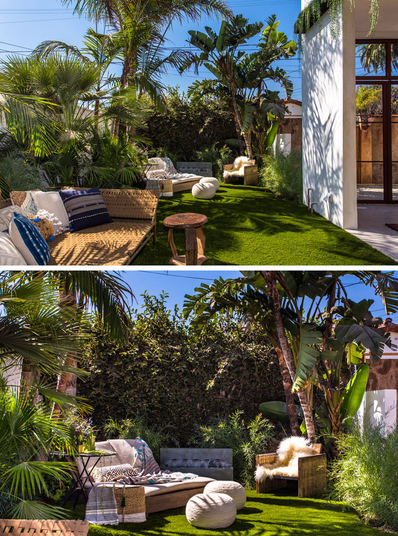 This backyard has been set up to have a variety of seating options and a water feature.