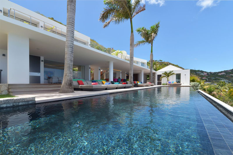 A large infinity edge swimming pool is located at the front of this villa, positioned for amazing views.