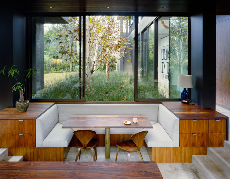 Dining Room Idea - Create A Built-In Dining Nook // This built-in dining nook has been sunken into the floor, with hidden drawers neatly tucked into the side. Large windows can be opened to let you feel like you are dining outdoors. #DiningNook #BuiltInDiningNook #BanquetteSeating #DiningRoom