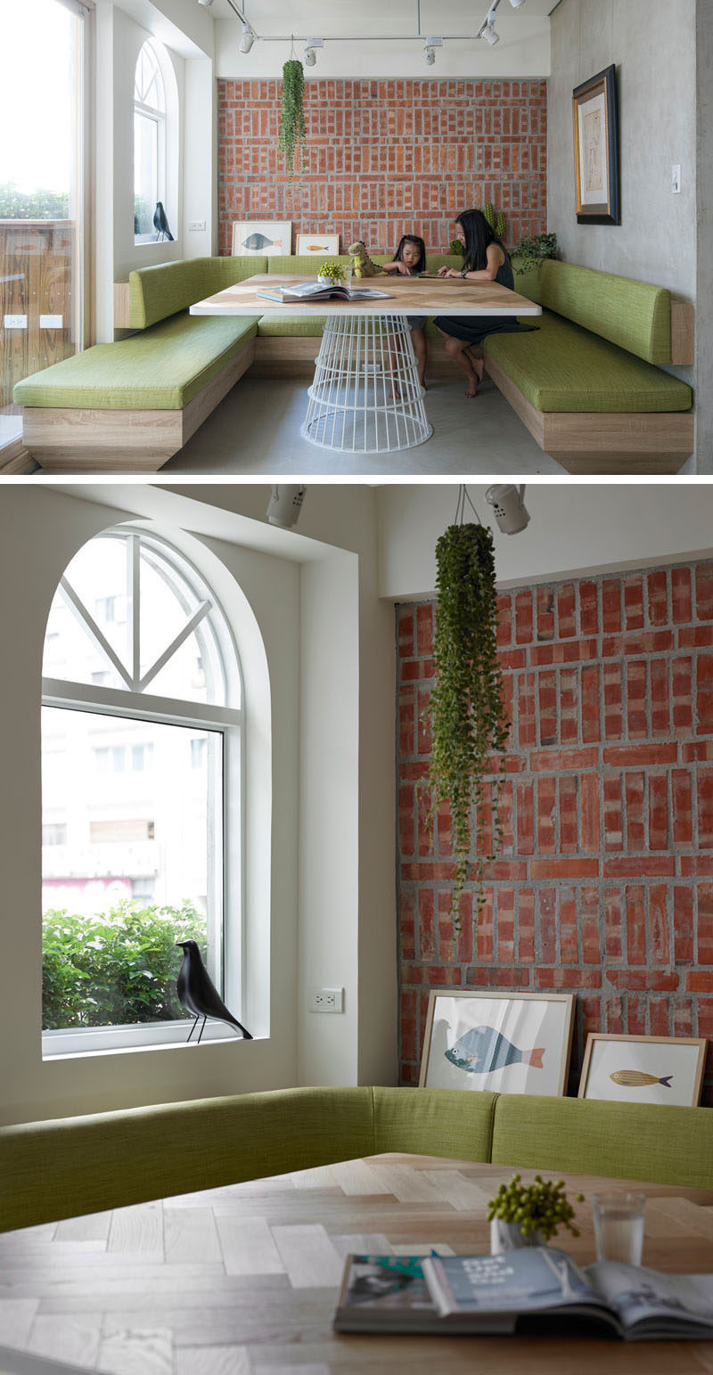 Dining Room Idea - Create A Built-In Dining Nook // Light wood and soft green cushions soften up the brick feature wall, and make this dining area a calm place to spend time eating or gathering around with friends and family. #DiningNook #BuiltInDiningNook #BanquetteSeating #DiningRoom