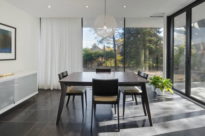 glass pendant lights over dining table