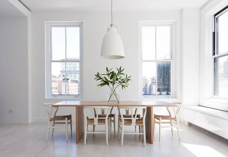 8 Lighting Ideas For Above Your Dining Table // A Single Pendant Light -- They come in such a huge variety of sizes, shapes, colors, finishes, and sub-styles.