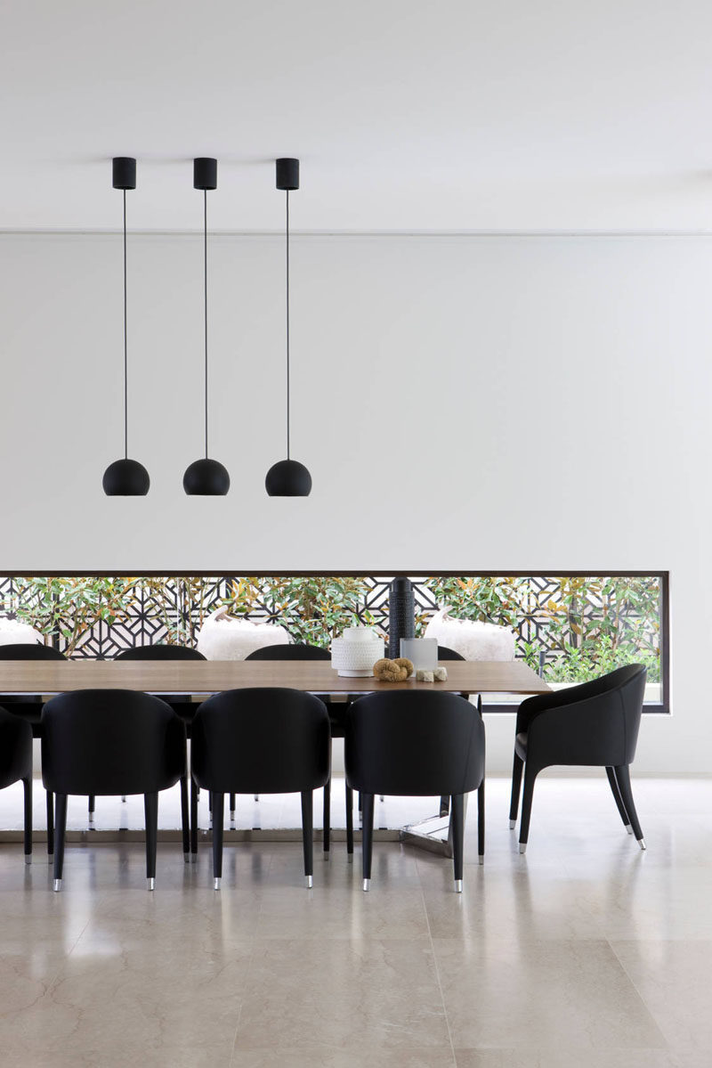 glass pendant lights over dining table